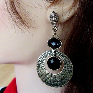 Textured brass dangling pierced earrings with faux onyx stones